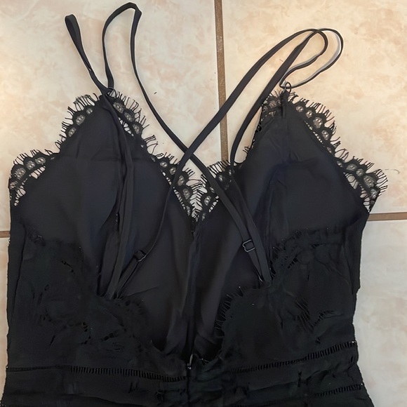 This is a black, pant leg, lacy onesie. Great for a dinner, formal event, etc. - Picture 4 of 4